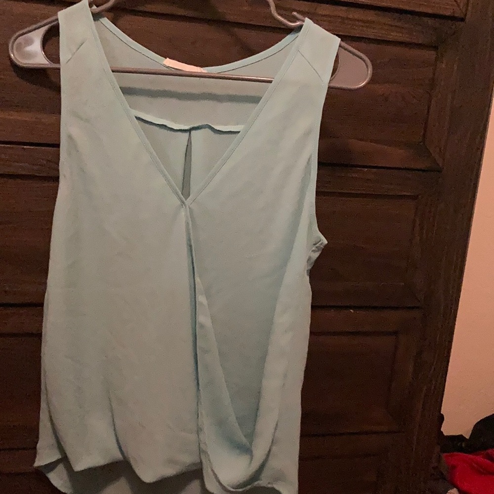 Teal colored blouse